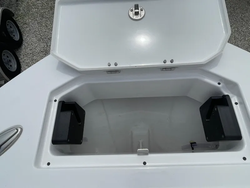 Slide: The Image of Open storage compartment on 2026 Blackfin 222CC boat, showing interior space. - 5
