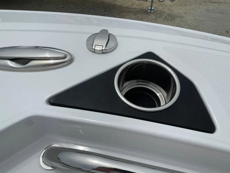 Slide: The Image of 2026 Blackfin 222CC boat detail with cup holder and sleek metal fixtures. - 7