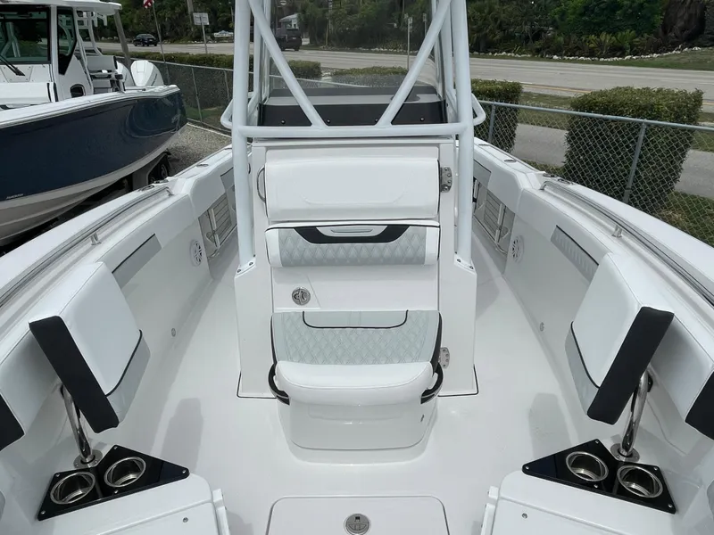 Slide: The Image of 2026 Blackfin 222CC boat interior with white seating and cup holders. - 9
