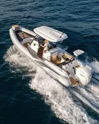 Slide: The Image of 2025 Grand Inflatables G750 boat cruising on open water. - 11
