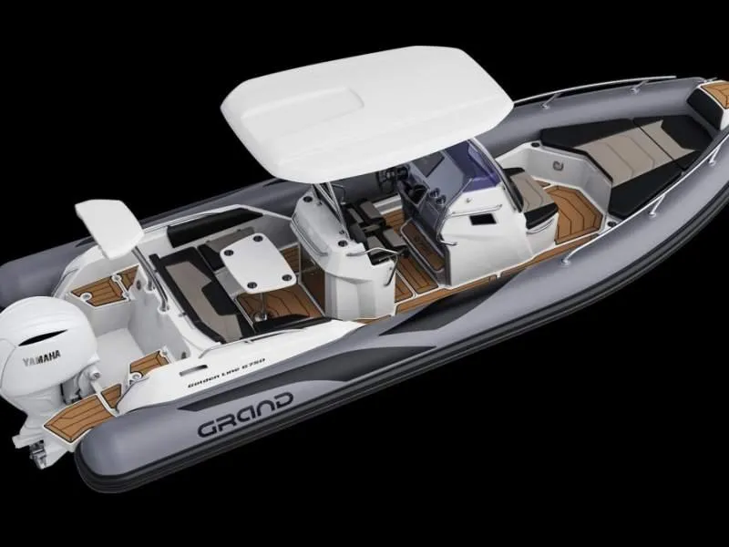 Slide: The Image of 2025 Grand Inflatables G750 boat with Yamaha engine, featuring sleek design and spacious seating. - 2