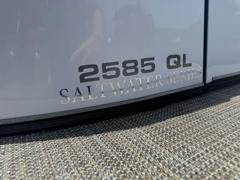 Slide: The Image of 2025 Avalon Catalina Platinum 2585 QL Saltwater Series logo on boat exterior. - 14