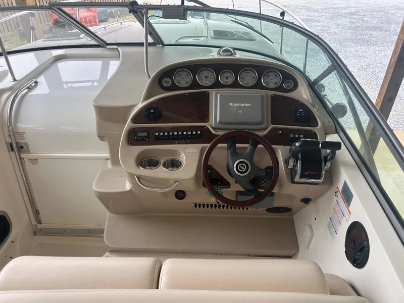 Slide: The Image of 2007 Chaparral Signature 330 boat dashboard with steering wheel and navigation instruments. - 6