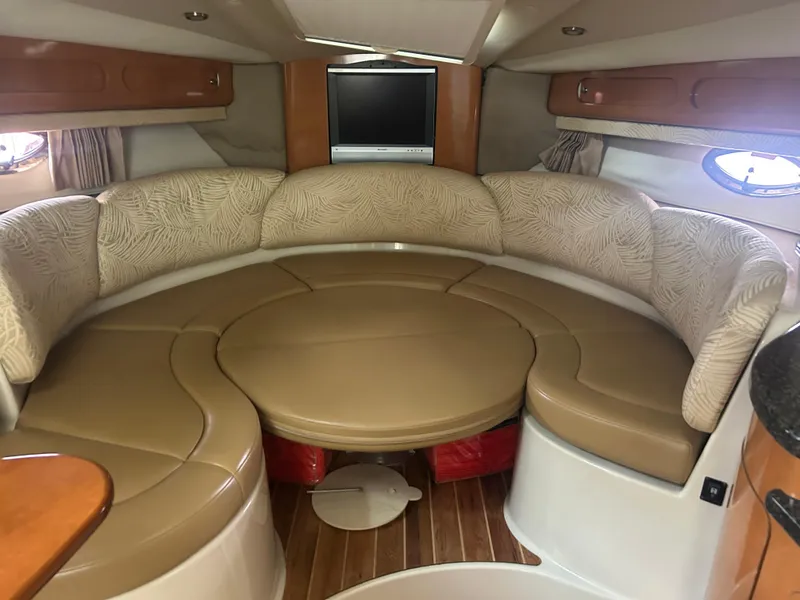 Slide: The Image of 2007 Chaparral Signature 330 interior with circular seating and TV. - 7
