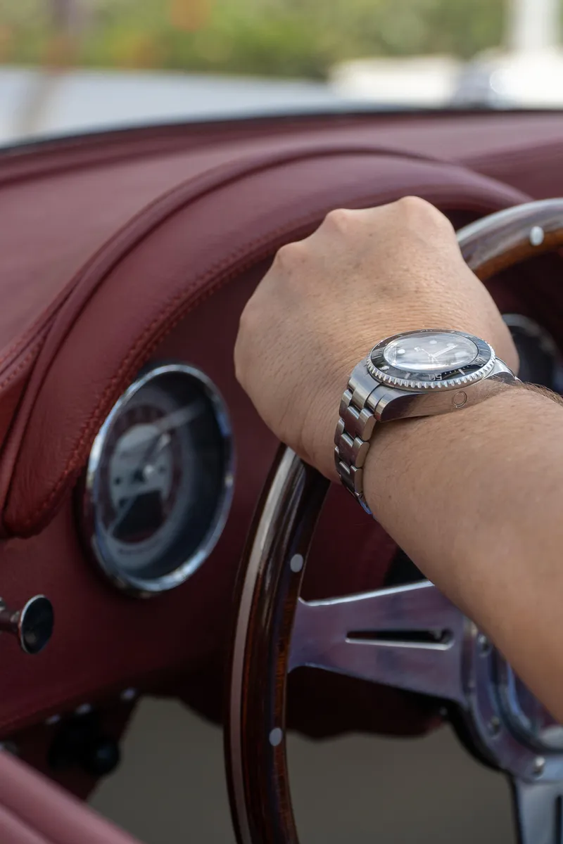 Slide: The Image of Hand on steering wheel of 2025 Seven Seas Yachts Venus Speedster, featuring luxury watch. - 3