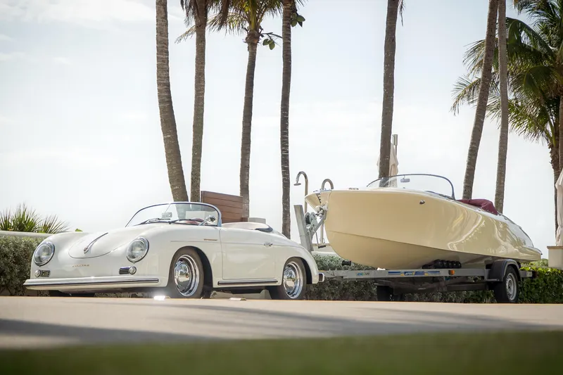Slide: The Image of Classic car beside 2025 Seven Seas Yachts Venus Speedster, parked under palm trees. - 4