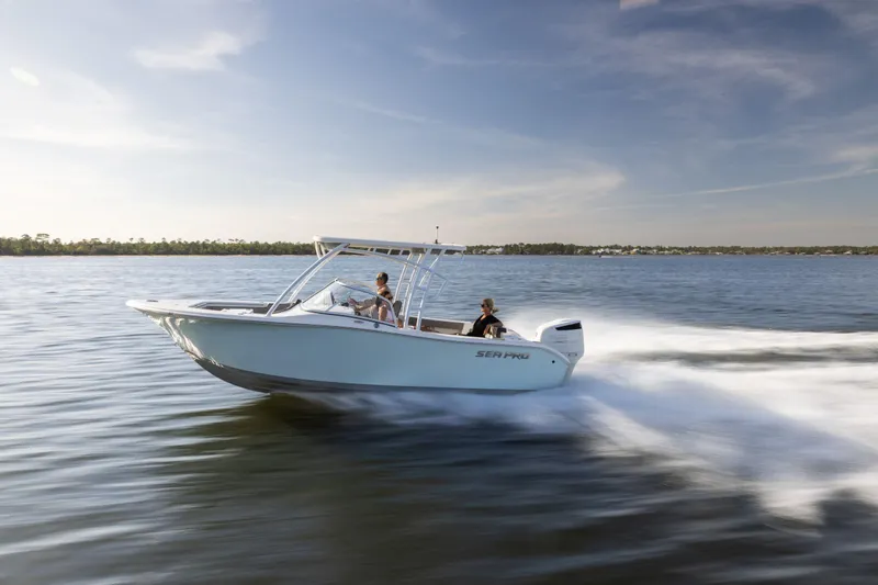 The Image of 2025 Sea Pro 240 Dual Console boat cruising on open water, side view. - 0
