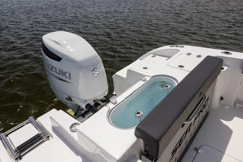 Slide: The Image of 2025 Sea Pro 240 Dual Console boat with Suzuki outboard motor on water. - 11