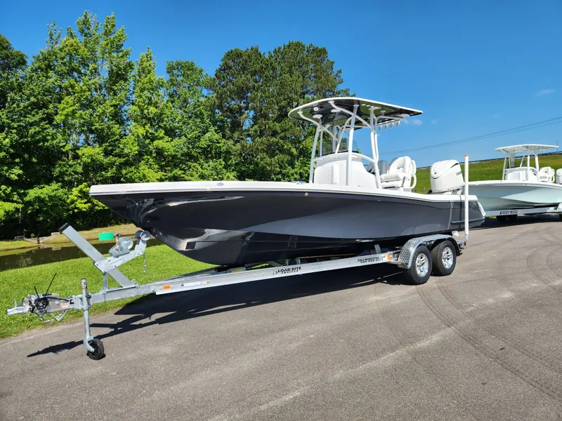 Slide: The Image of 2025 BlackJack 256 Coastal boat on trailer, parked outdoors, sunny day. - 1