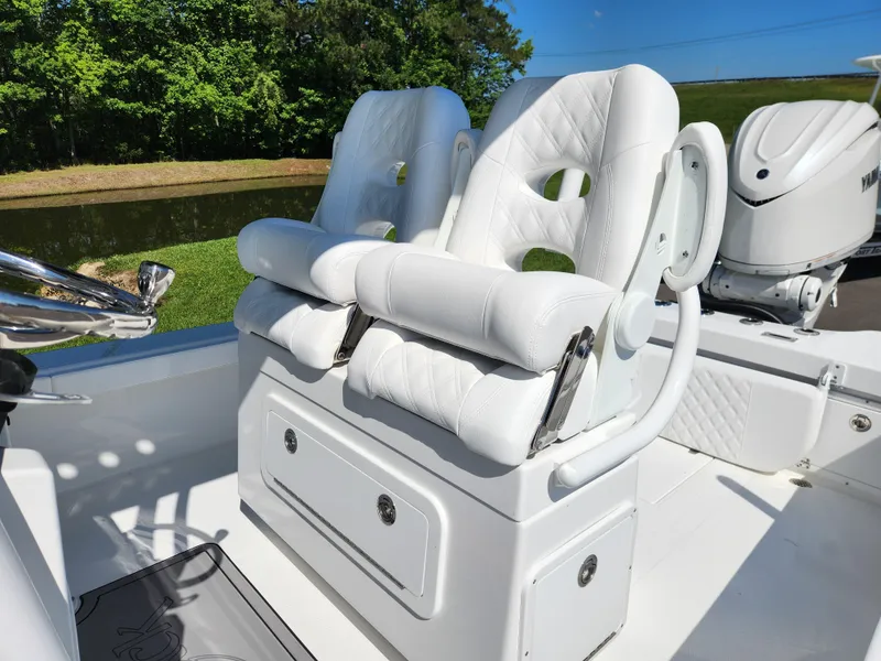 Slide: The Image of 2025 BlackJack 256 Coastal boat with white cushioned seats and sleek design. - 19