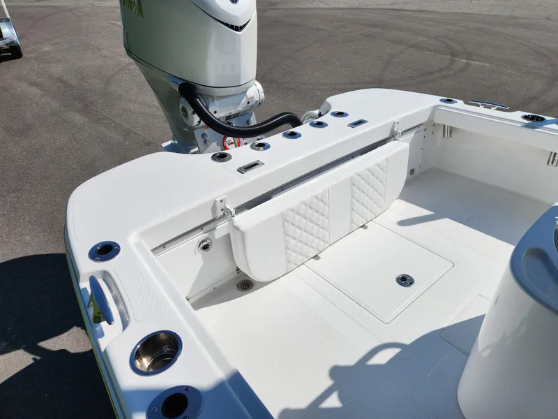 Slide: The Image of 2025 BlackJack 256 Coastal boat interior with engine and seating area. - 7