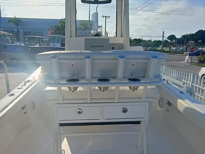Slide: The Image of 2025 Regulator 23 Center Console boat interior with Garmin system and storage drawers. - 14