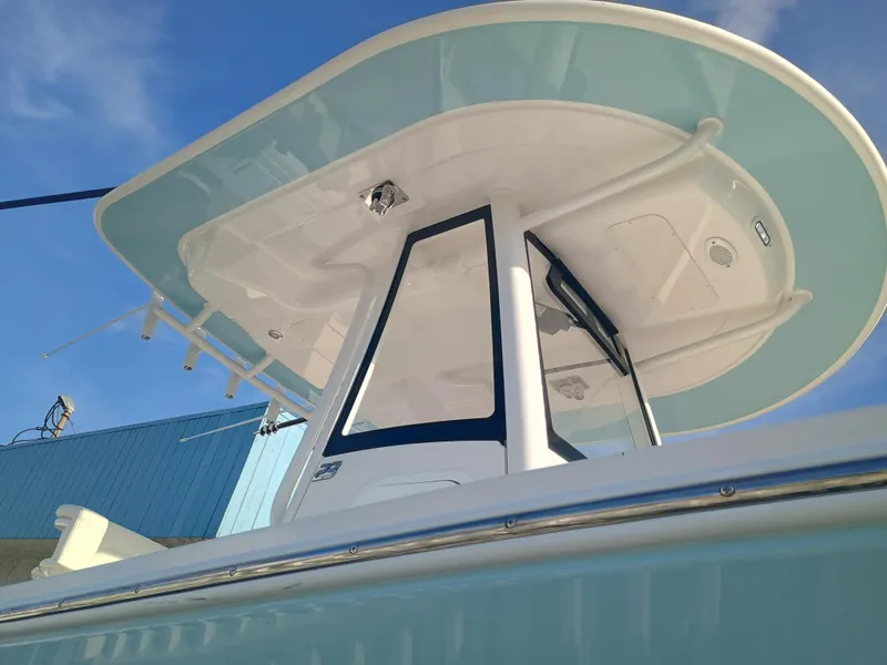 Slide: The Image of 2025 Regulator 23 Center Console boat, featuring sleek design and modern canopy. - 29
