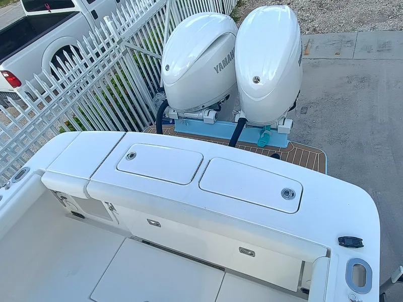 Slide: The Image of 2025 Regulator 23 Center Console with dual Yamaha outboard engines, viewed from above. - 33