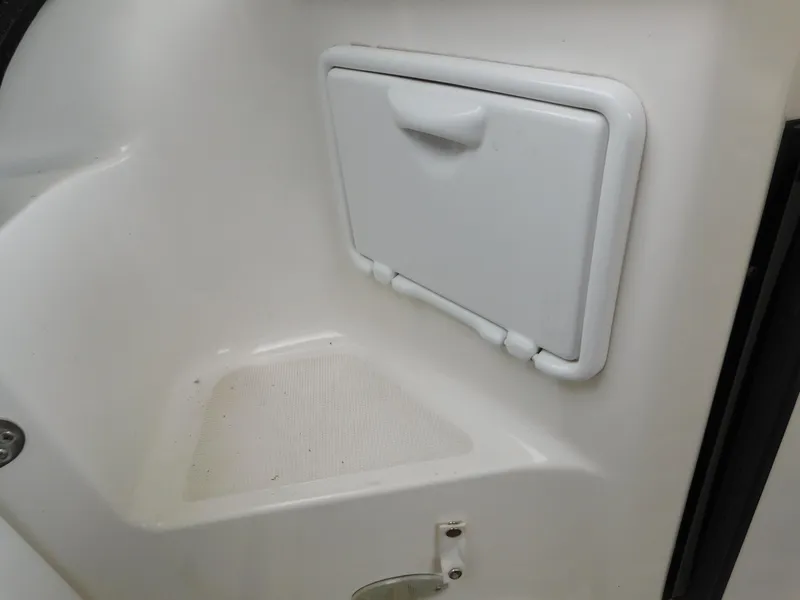 Slide: The Image of 2003 Regal 2860 Commodore boat storage compartment with white hatch door. - 14
