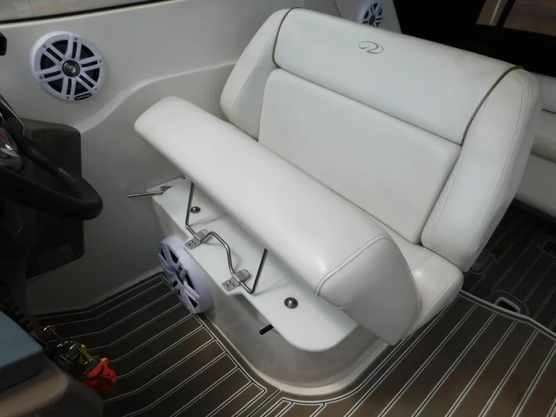 Slide: The Image of 2003 Regal 2860 Commodore boat interior with white seating and speaker system. - 30