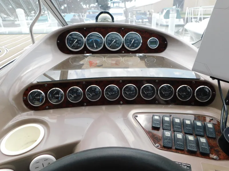 Slide: The Image of Dashboard of 2003 Regal 2860 Commodore boat with gauges and controls. - 33