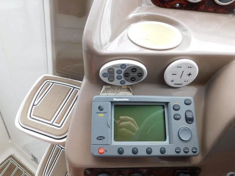 Slide: The Image of Control panel of a 2003 Regal 2860 Commodore boat with navigation system. - 36