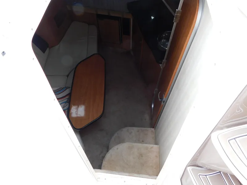 Slide: The Image of Interior view of 2003 Regal 2860 Commodore boat cabin with seating and table. - 43