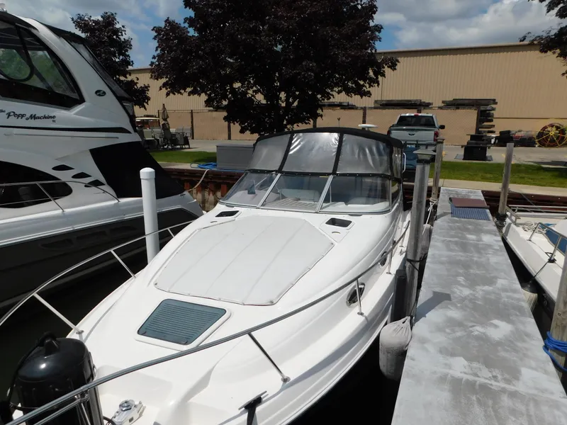 Slide: The Image of 2003 Regal 2860 Commodore boat docked at marina under cloudy sky. - 8