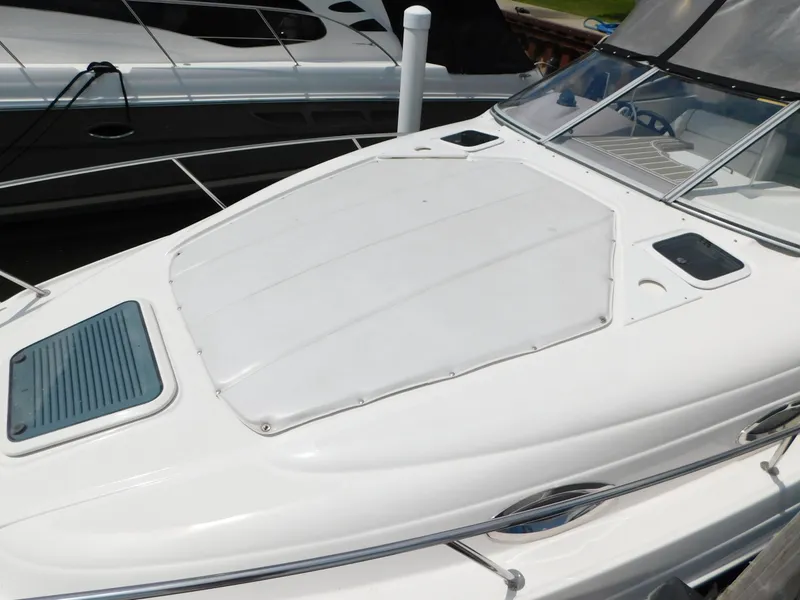 Slide: The Image of 2003 Regal 2860 Commodore boat deck with sleek design and windshield. - 9