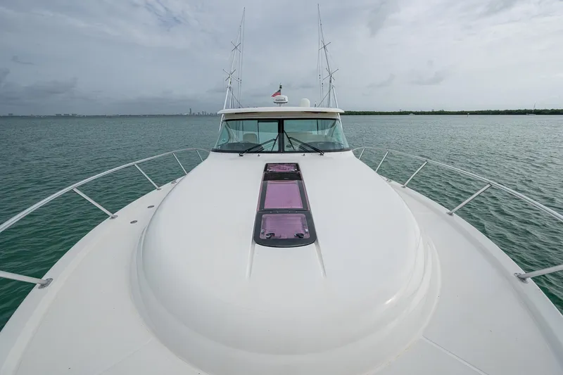 Slide: The Image of 2009 Tiara Yachts 39 Open on calm water, showcasing sleek design and spacious deck. - 26