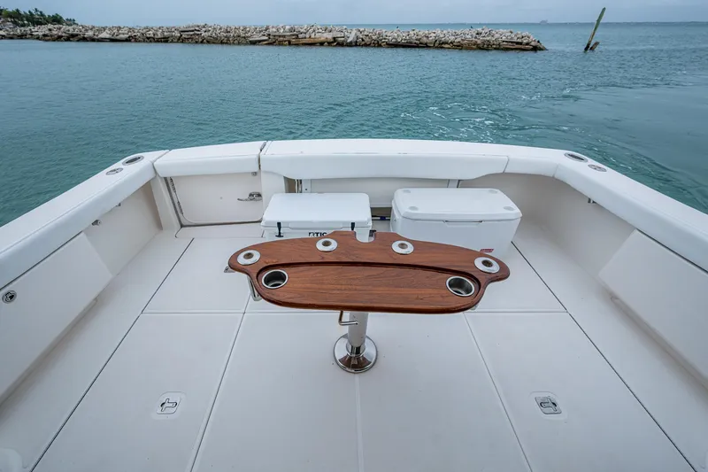 Slide: The Image of 2009 Tiara Yachts 39 Open deck with wooden table, ocean view. - 29