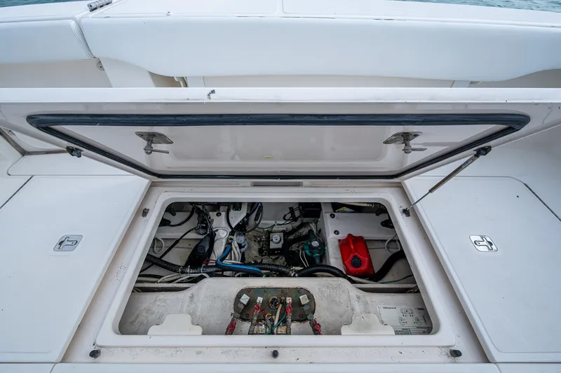 Slide: The Image of 2009 Tiara Yachts 39 Open engine compartment with open hatch, showcasing internal components. - 33