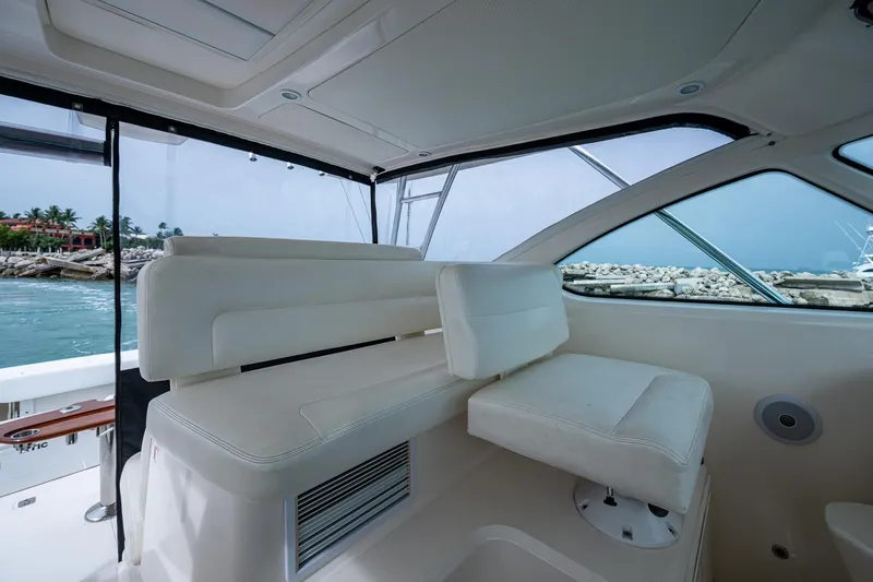 Slide: The Image of 2009 Tiara Yachts 39 Open interior with white seating and ocean view. - 40