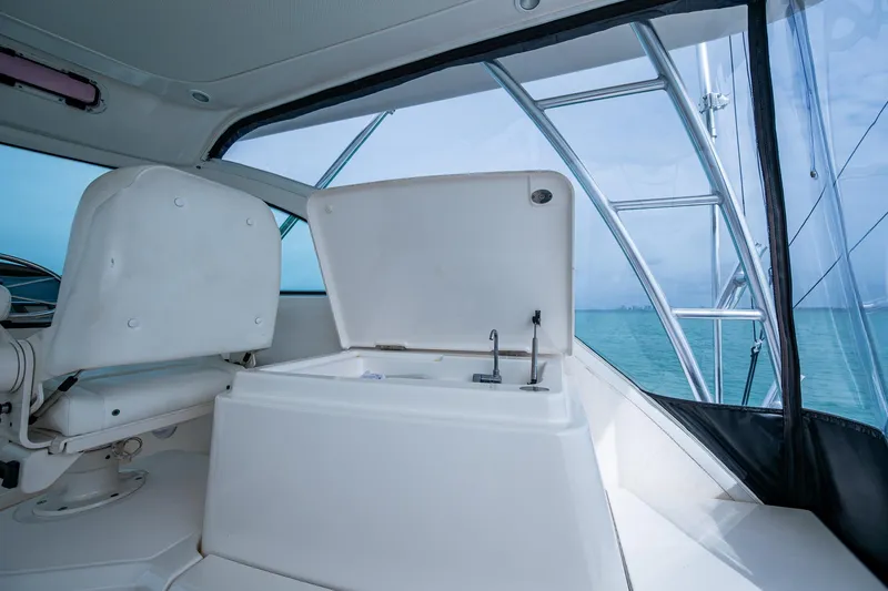 Slide: The Image of 2009 Tiara Yachts 39 Open interior with open storage compartment and seating. - 44