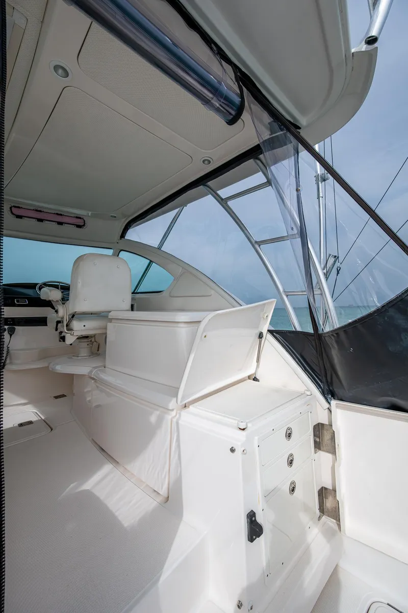 Slide: The Image of 2009 Tiara Yachts 39 Open interior with seating and helm, showcasing sleek design. - 45