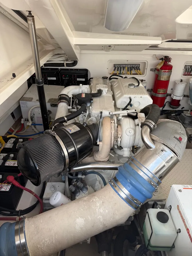 Slide: The Image of Engine room of 2009 Tiara Yachts 39 Open, featuring mechanical components and fire extinguisher. - 46