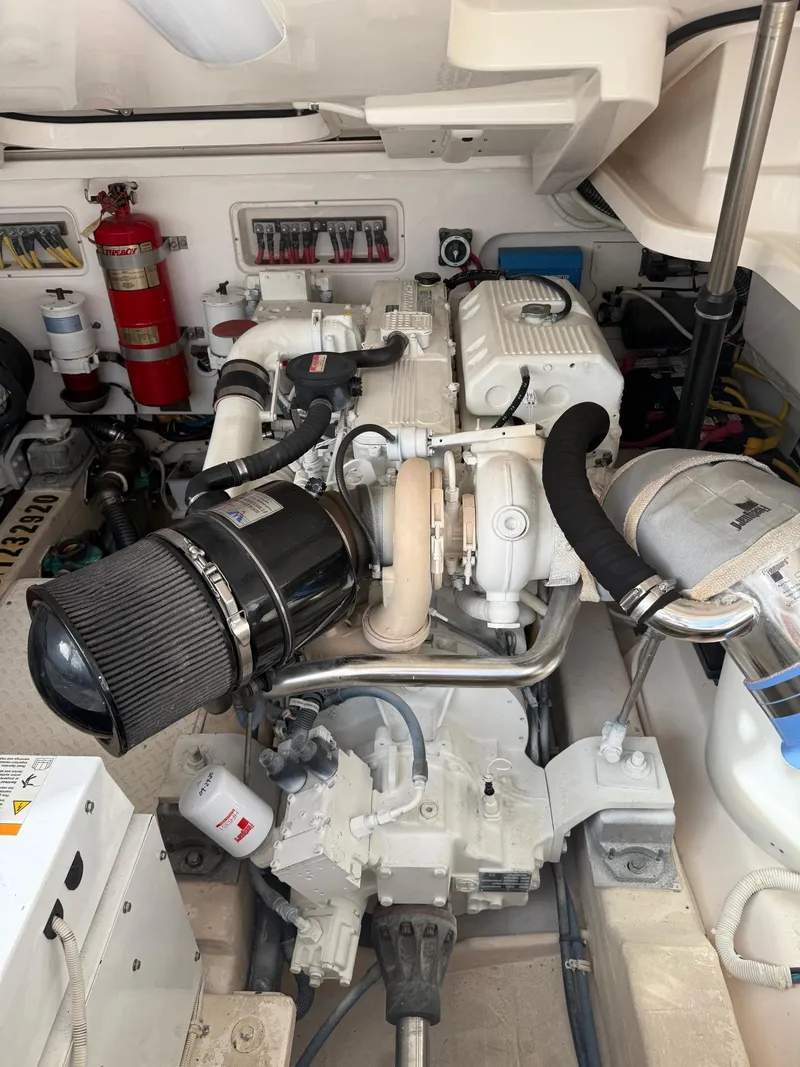 Slide: The Image of Engine room of 2009 Tiara Yachts 39 Open, featuring detailed mechanical components. - 47
