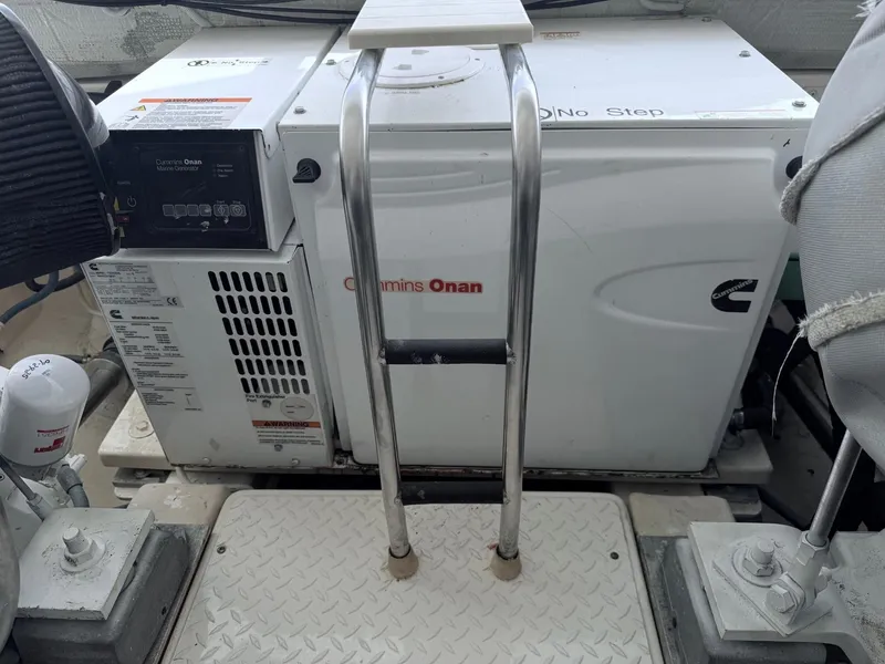 Slide: The Image of Cummins Onan generator on 2009 Tiara Yachts 39 Open, with metal ladder and platform. - 49