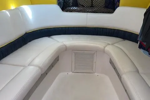 Slide: The Image of Interior seating of a 2000 Donzi 38 ZX boat with white upholstery. - 24