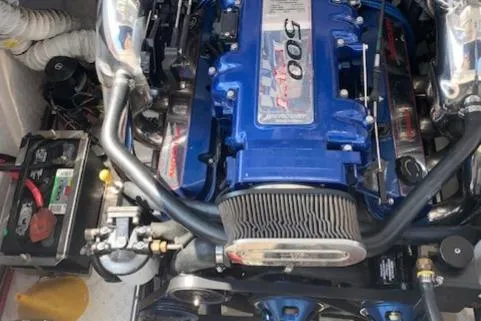 Slide: The Image of Engine of a 2000 Donzi 38 ZX boat, featuring a blue high-performance setup. - 28