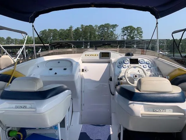 Slide: The Image of 2000 Donzi 38 ZX boat cockpit with dual seats and control panel. - 7