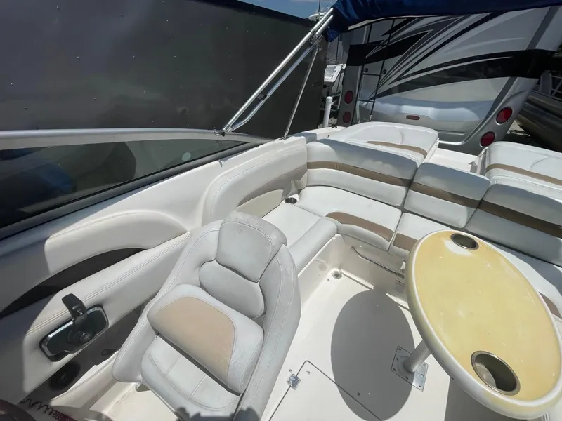 Slide: The Image of 2005 Chaparral 236SSi boat interior with seating and table. - 11