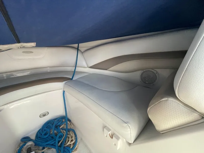 Slide: The Image of Interior of a 2005 Chaparral 236SSi boat with seating and blue rope. - 15
