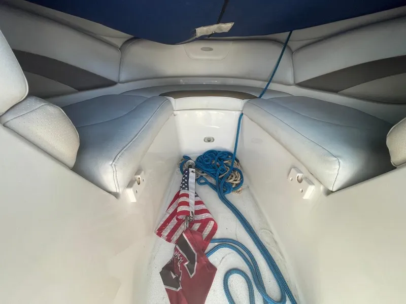 Slide: The Image of Interior of 2005 Chaparral 236SSi boat with American flag and blue rope. - 16