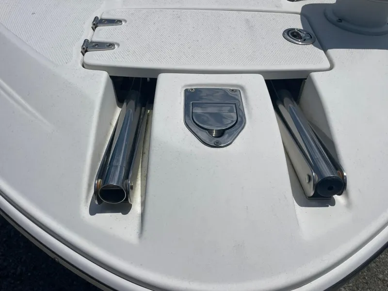 Slide: The Image of 2005 Chaparral 236SSi boat deck with stainless steel fittings and hatch. - 19