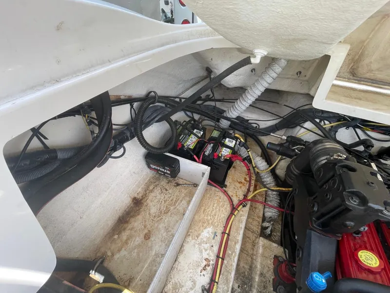Slide: The Image of Engine compartment of 2005 Chaparral 236SSi boat with wiring and components visible. - 23