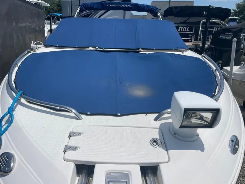 Slide: The Image of Chaparral 236SSi 2005 boat with blue cover and spotlight on deck. - 4