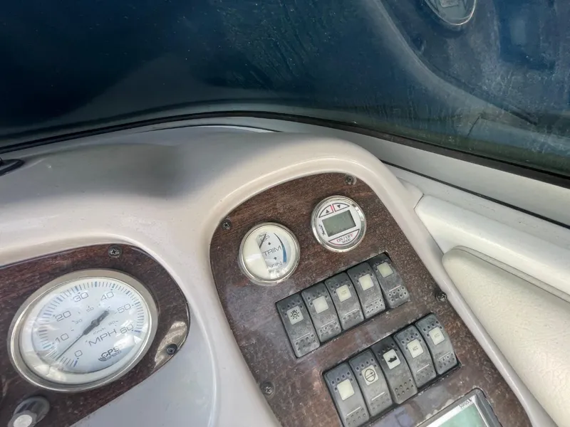Slide: The Image of Dashboard of a 2005 Chaparral 236SSi boat with gauges and switches. - 9