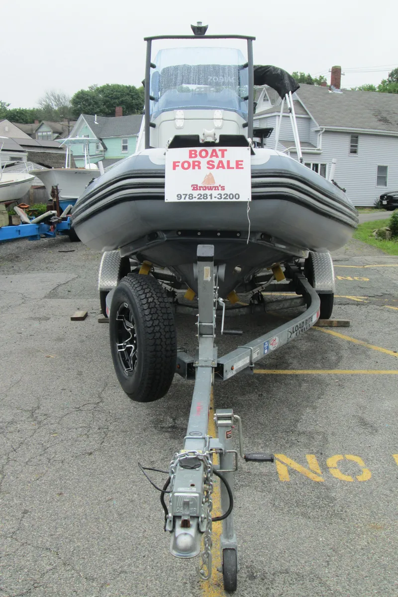 Slide: The Image of 2020 Zodiac Open 5.5 boat for sale on trailer in parking lot. - 4