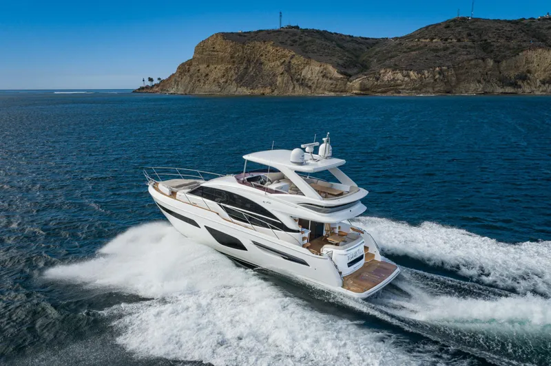 Slide: The Image of Luxury Princess F55 yacht cruising near rocky coastline, 2022 model. - 0