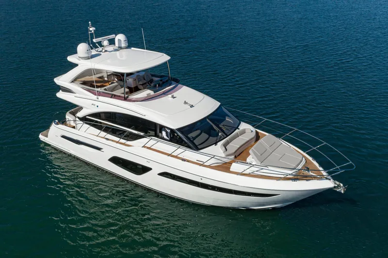 Slide: The Image of Luxurious 2022 Princess F55 yacht cruising on calm blue waters. - 15