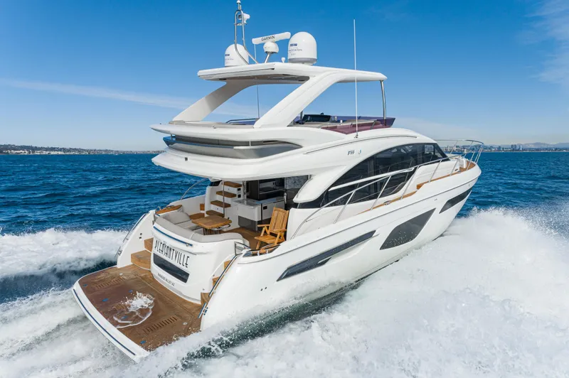 Slide: The Image of Luxurious 2022 Princess F55 yacht cruising on open sea under clear blue sky. - 2
