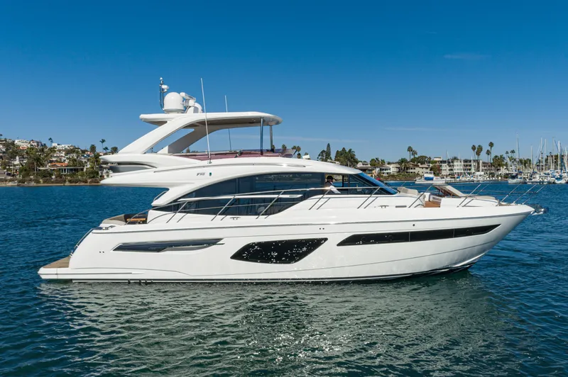 Slide: The Image of Luxury 2022 Princess F55 yacht cruising on a sunny day, coastal background. - 20