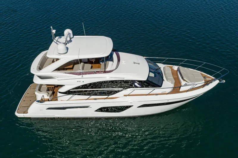 Slide: The Image of 2022 Princess F55 yacht cruising on open water, showcasing sleek design and luxury features. - 21